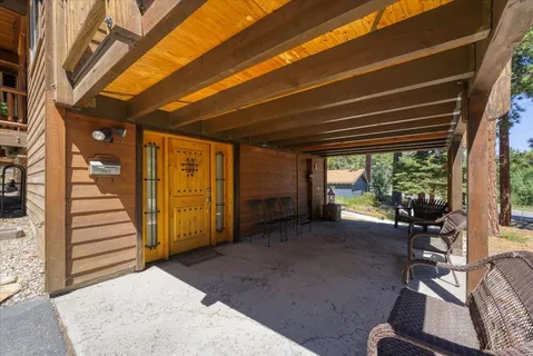 a view of a room with wooden floor and furniture