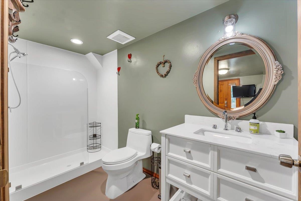 200 Estates Drive Tahoe Vista, CA 96148 - Photo 24 of 25 a bathroom with a toilet a sink and a mirror
