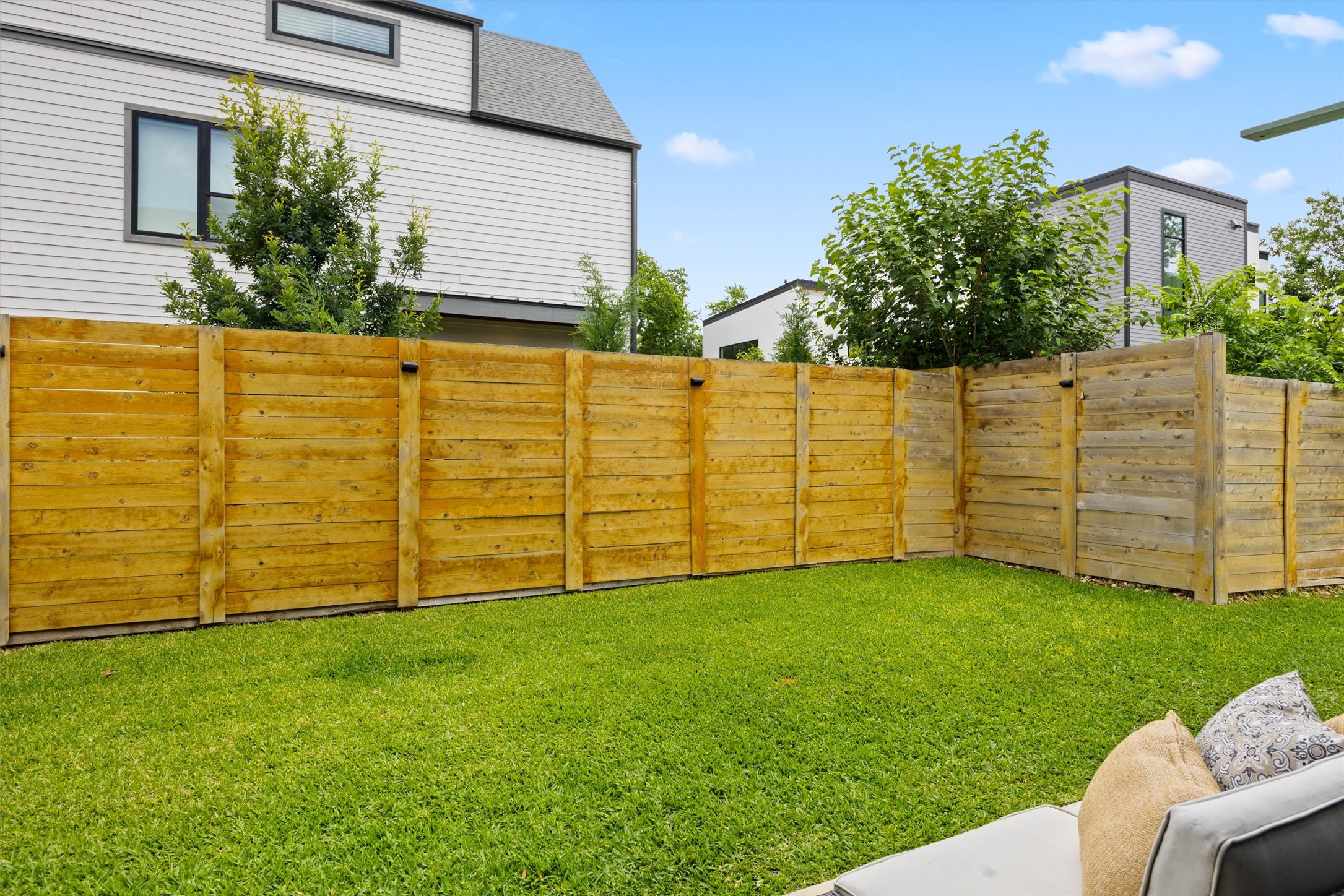 1116 Stobaugh Street, Unit B Austin, TX 78757 - Photo 30 of 38 The back yard offers plenty of room for pets, grilling, or casual entertaining.