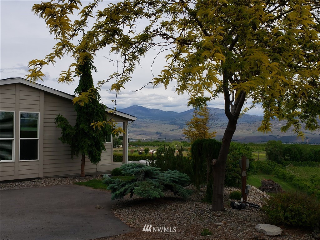 12 Caudill Road Omak, WA 98841 - Photo 1 of 37 a view of a house with a tree in a yard