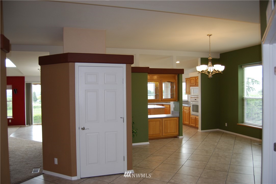 12 Caudill Road Omak, WA 98841 - Photo 11 of 37 a view of a livingroom with a chandelier fan and kitchen view