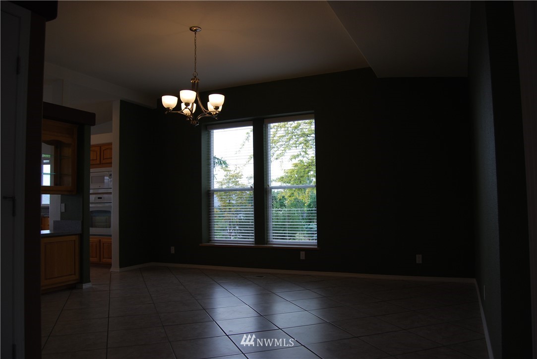 12 Caudill Road Omak, WA 98841 - Photo 13 of 37 a view of a hallway with windows and chandelier