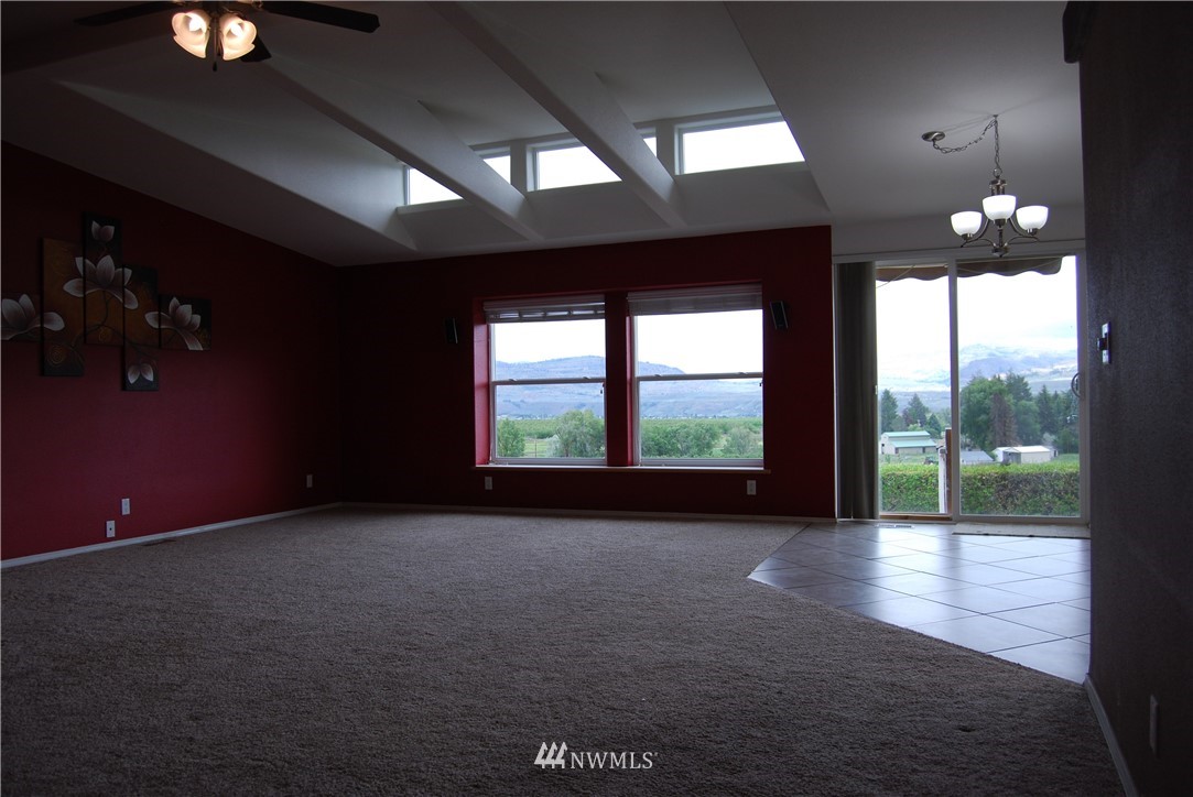 12 Caudill Road Omak, WA 98841 - Photo 17 of 37 a view of empty room with wooden floor and fan