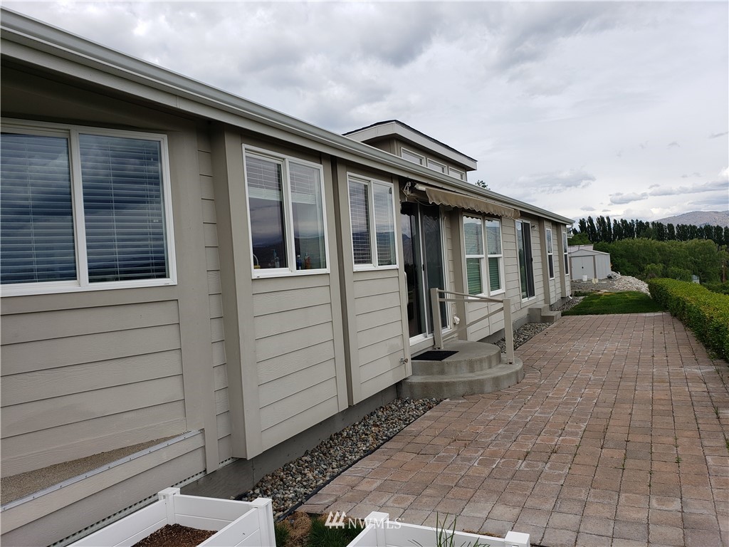 12 Caudill Road Omak, WA 98841 - Photo 7 of 37 a backyard of a house with seating space