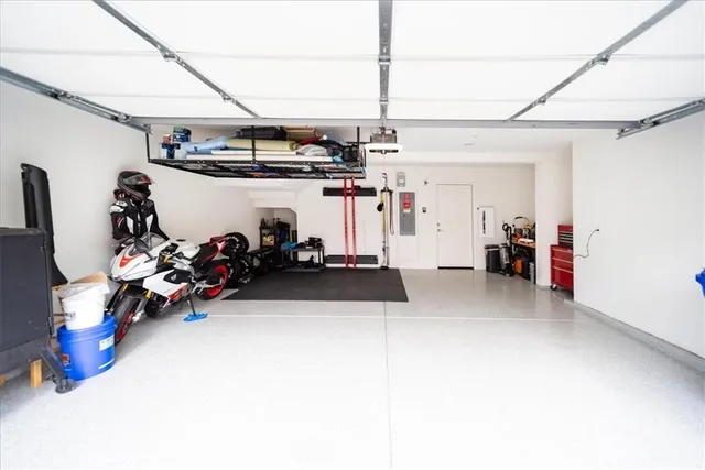 a front view of a house with a garden and houses