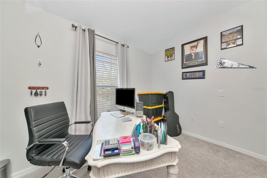 6205 Flagfish Court Lakewood Ranch, FL 34202 - Photo 21 of 67 a view of a workspace with furniture and a window