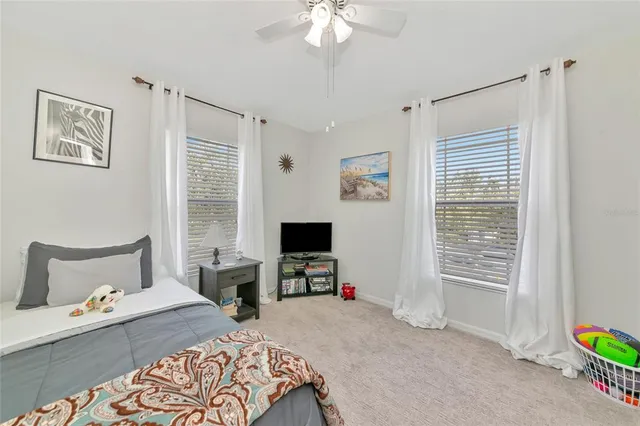 a view of walk in closet with clothes