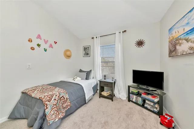 a view of a porch with furniture and a yard