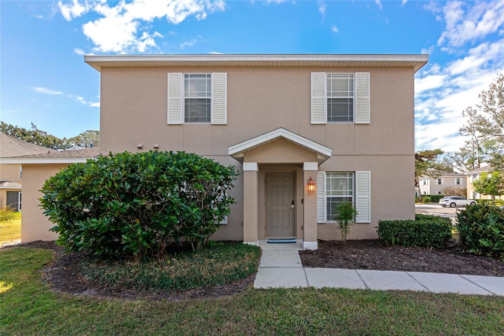 6205 Flagfish Court Lakewood Ranch, FL 34202 - Photo 3 of 67 a front view of a house with a yard and trees