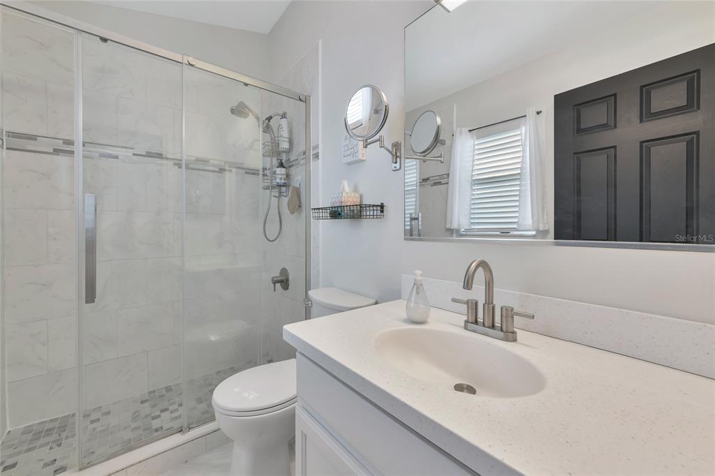 6205 Flagfish Court Lakewood Ranch, FL 34202 - Photo 32 of 67 a bathroom with a sink toilet and shower