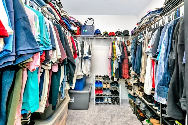 a view of a house with swimming pool and sitting area
