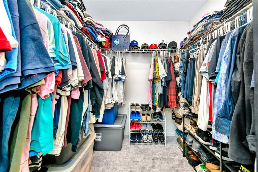 6205 Flagfish Court Lakewood Ranch, FL 34202 - Photo 33 of 67 a view of walk in closet with clothes