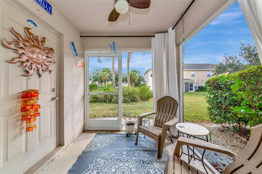 6205 Flagfish Court Lakewood Ranch, FL 34202 - Photo 34 of 67 a view of a porch with furniture and a yard