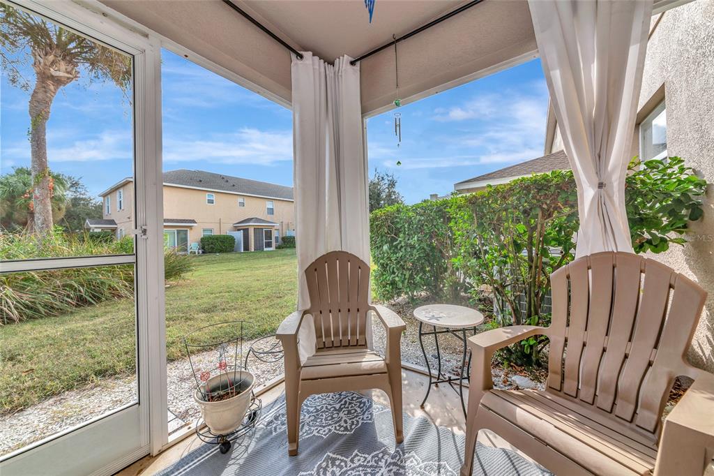 6205 Flagfish Court Lakewood Ranch, FL 34202 - Photo 35 of 67 a view of a porch with furniture and backyard