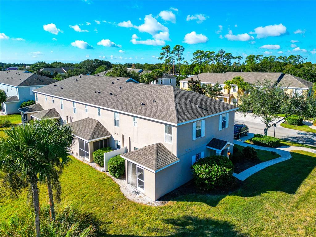 6205 Flagfish Court Lakewood Ranch, FL 34202 - Photo 44 of 67 an aerial view of a house with a big yard
