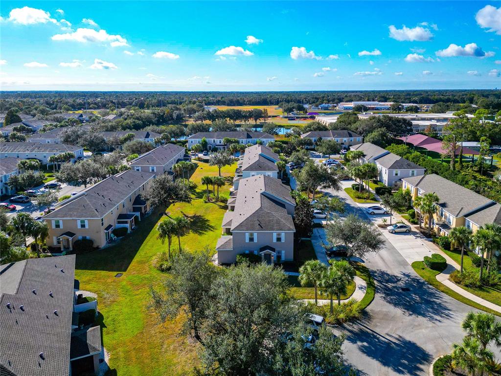 6205 Flagfish Court Lakewood Ranch, FL 34202 - Photo 59 of 67 an aerial view of residential houses with outdoor space and swimming pool