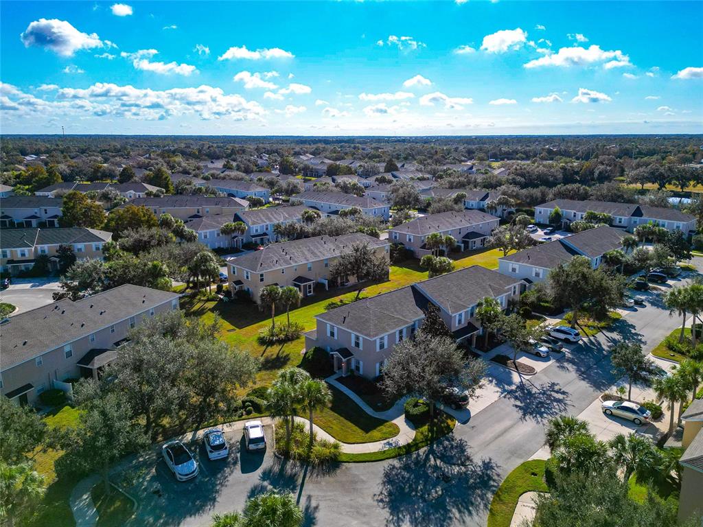 6205 Flagfish Court Lakewood Ranch, FL 34202 - Photo 60 of 67 an aerial view of a houses with a yard