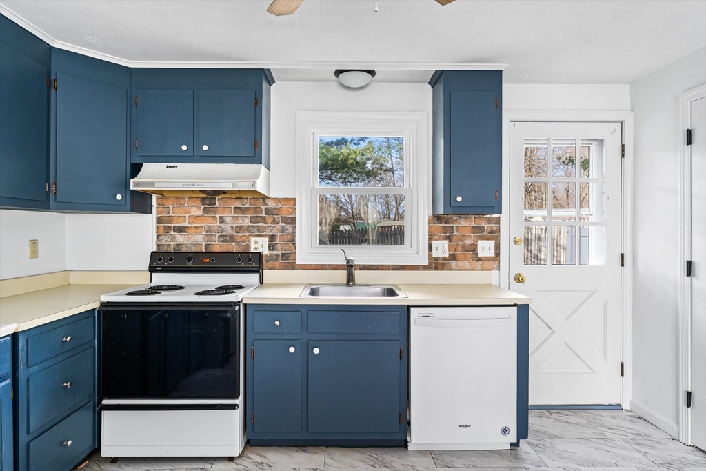41 South Street, Unit 11 Easthampton, MA 01027 - Photo 14 of 30 a kitchen with a sink stove and cabinets