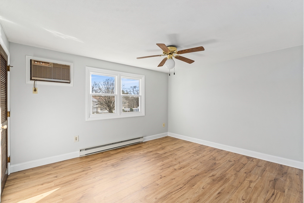 41 South Street, Unit 11 Easthampton, MA 01027 - Photo 5 of 30 a view of a big room with wooden floor and windows