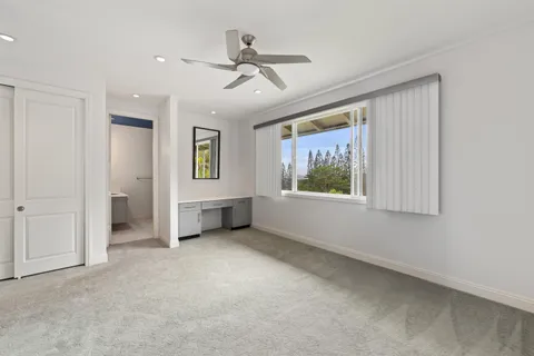 a spacious bathroom with a shower sink and mirror
