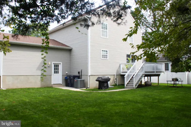 a front view of house with yard and seating area