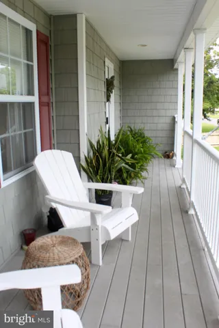 a view of balcony with furniture