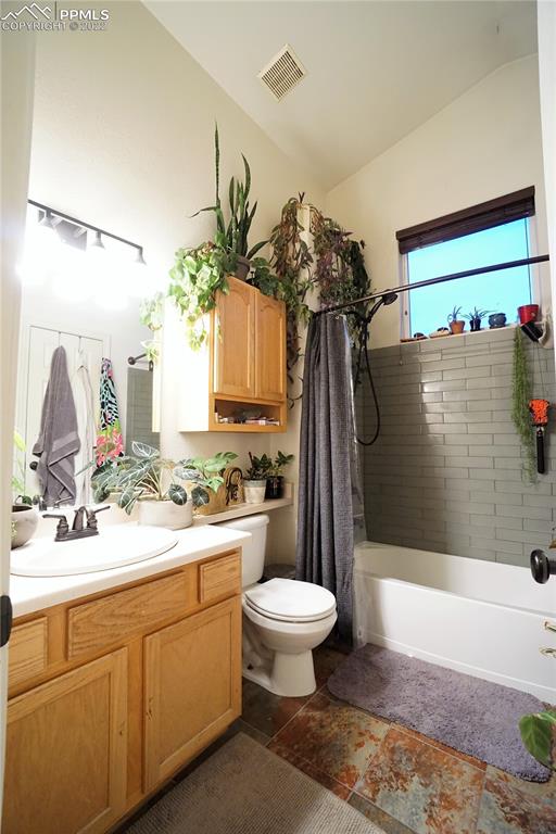 980 Mesa Valley Road, Unit 108 Colorado Springs, CO 80907 - Photo 14 of 21 a bathroom with a sink a toilet and shower