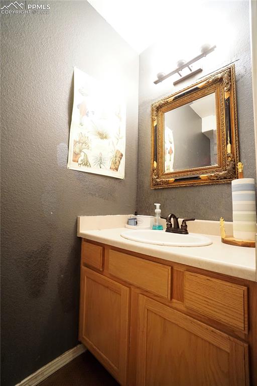 980 Mesa Valley Road, Unit 108 Colorado Springs, CO 80907 - Photo 19 of 21 a bathroom with a sink and a mirror