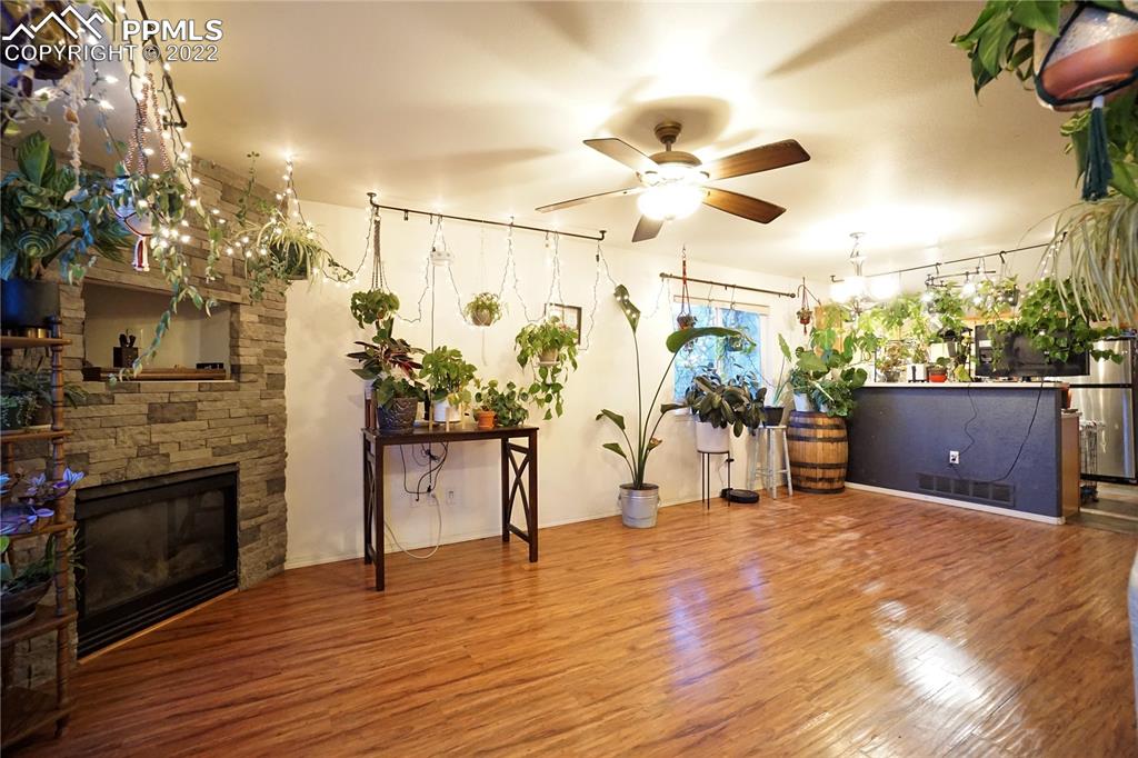 980 Mesa Valley Road, Unit 108 Colorado Springs, CO 80907 - Photo 4 of 21 a living room with furniture and a fireplace