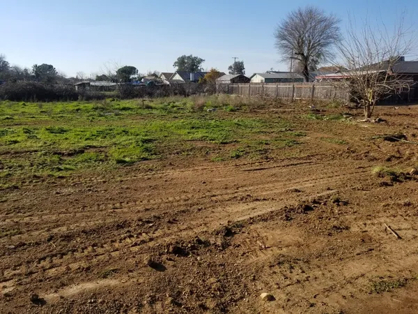 a view of a backyard of the house