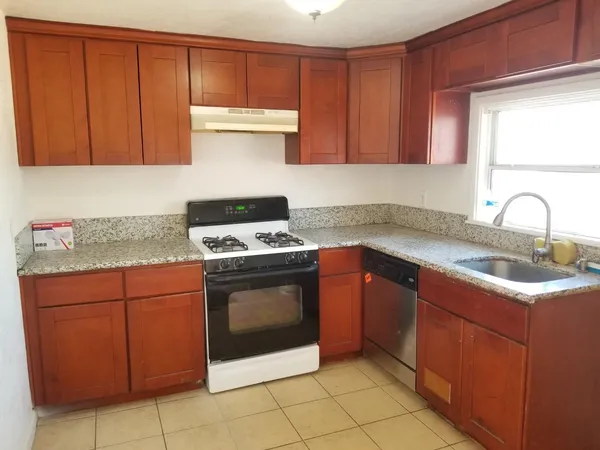 a view of room with wooden floor and window