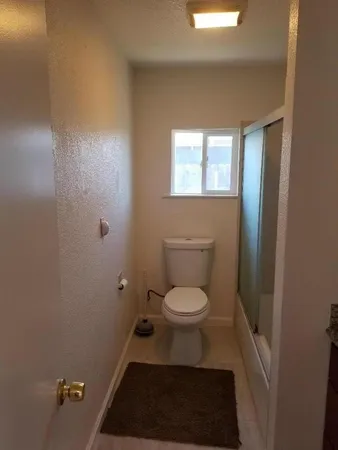 a bathroom with a granite countertop sink and vanity