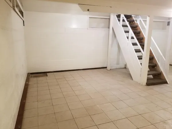 a view of entryway with stairs and white walls