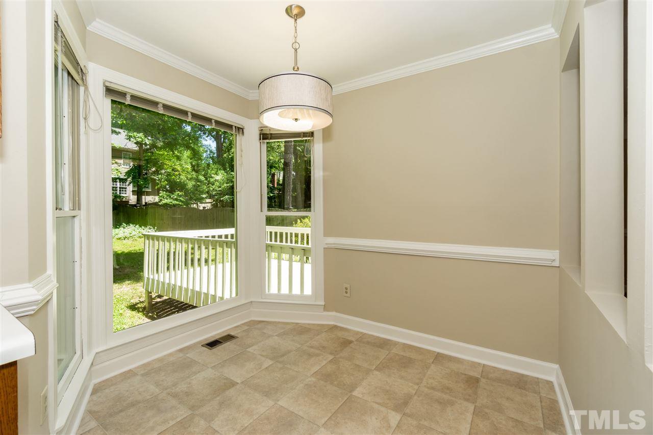 8113 Coleraine Court Raleigh, NC 27615 - Photo 11 of 28 Breakfast Nook overlooking backyard with mature trees and filtered light.