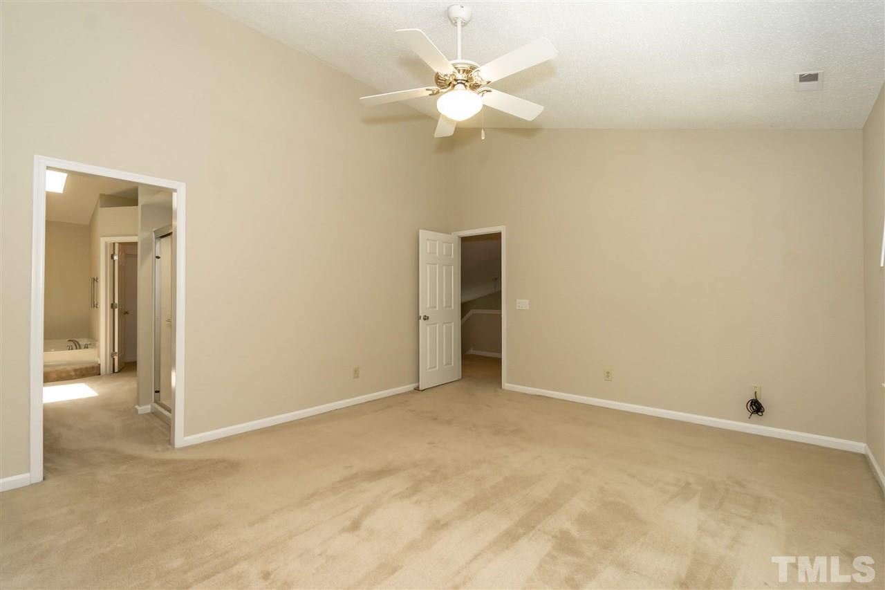 8113 Coleraine Court Raleigh, NC 27615 - Photo 21 of 28 Master Bedroom with en suite bath, walk in closet and private water closet.