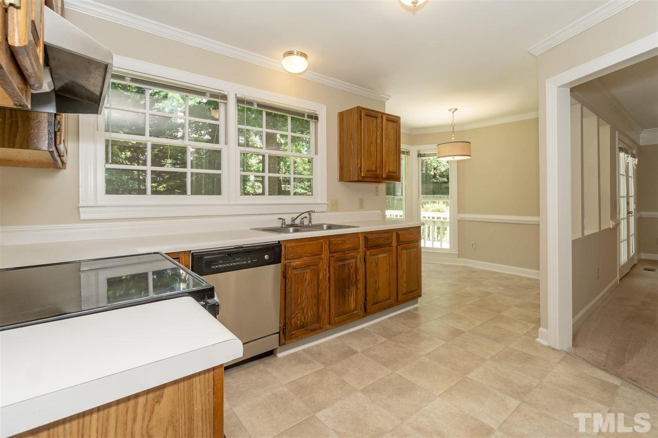 8113 Coleraine Court Raleigh, NC 27615 - Photo 8 of 28 Kitchen With Stainless Steel appliances and Pantry.