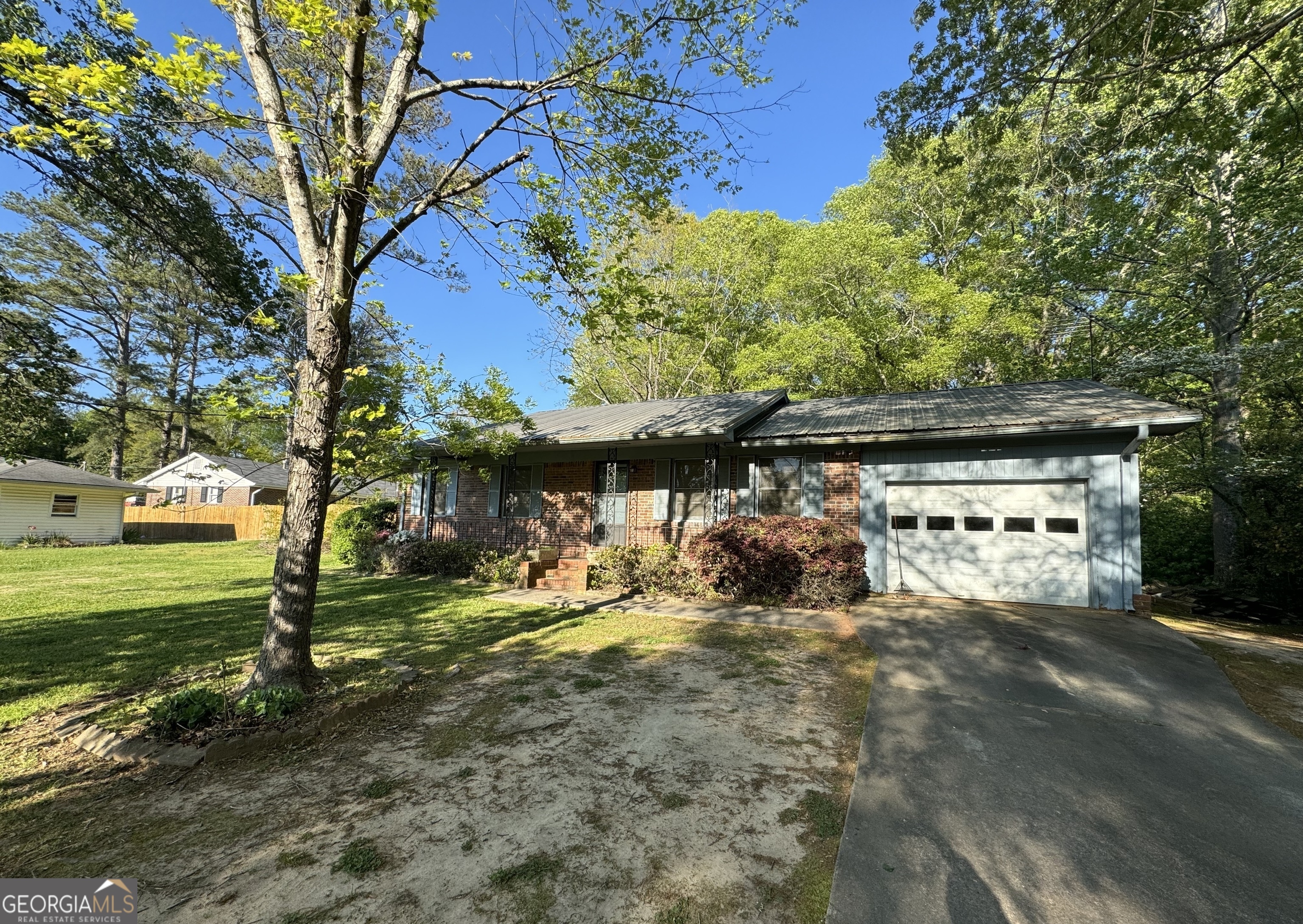 a view of a yard with an outdoor space