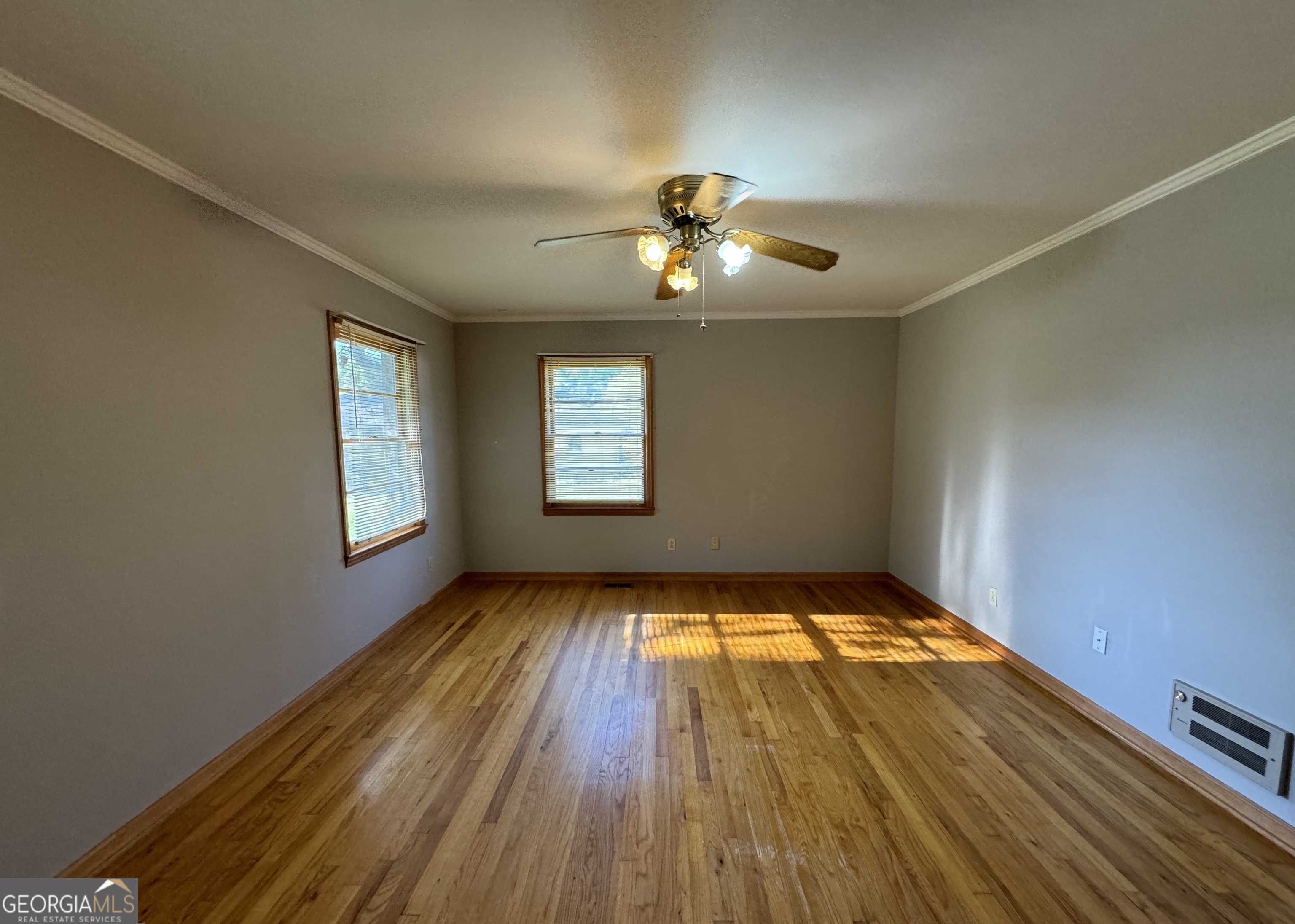 133 McCaskill Drive Jackson, GA 30233 - Photo 15 of 26 wooden floor in an empty room with a window