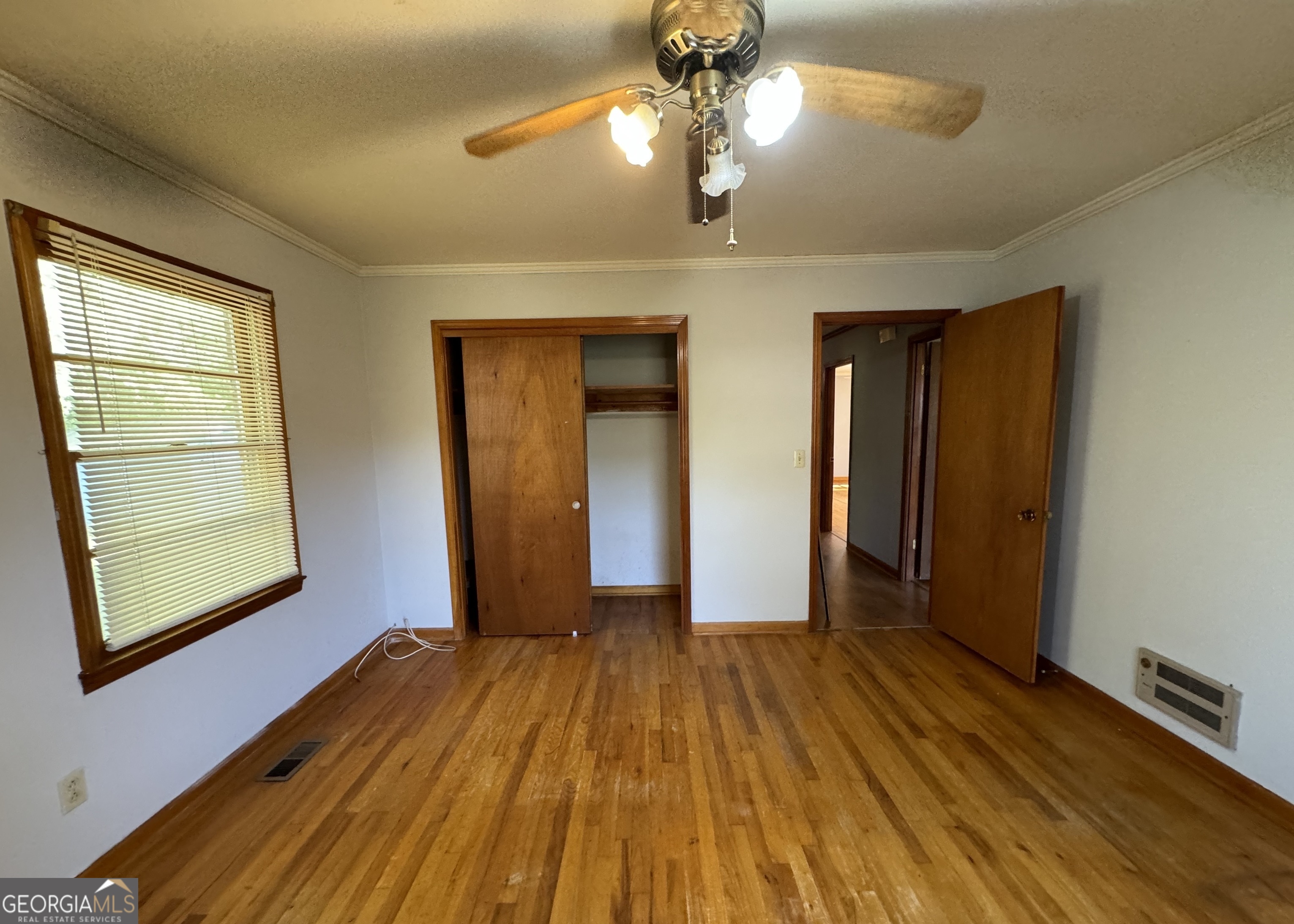 133 McCaskill Drive Jackson, GA 30233 - Photo 19 of 26 a view of empty room with wooden floor and fan