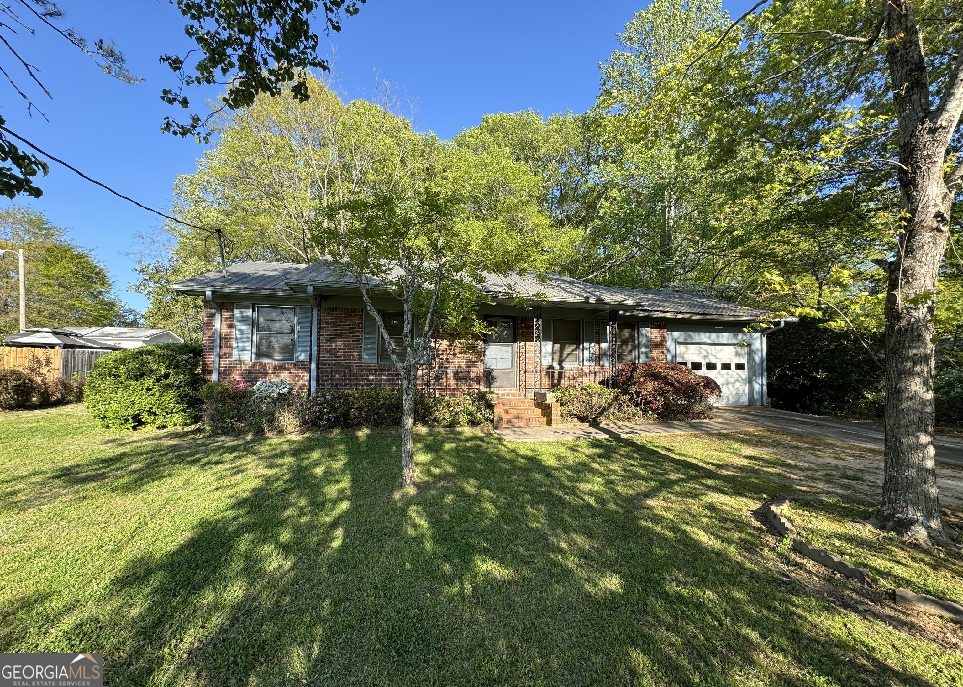 133 McCaskill Drive Jackson, GA 30233 - Photo 2 of 26 a view of a house with a yard balcony and sitting area