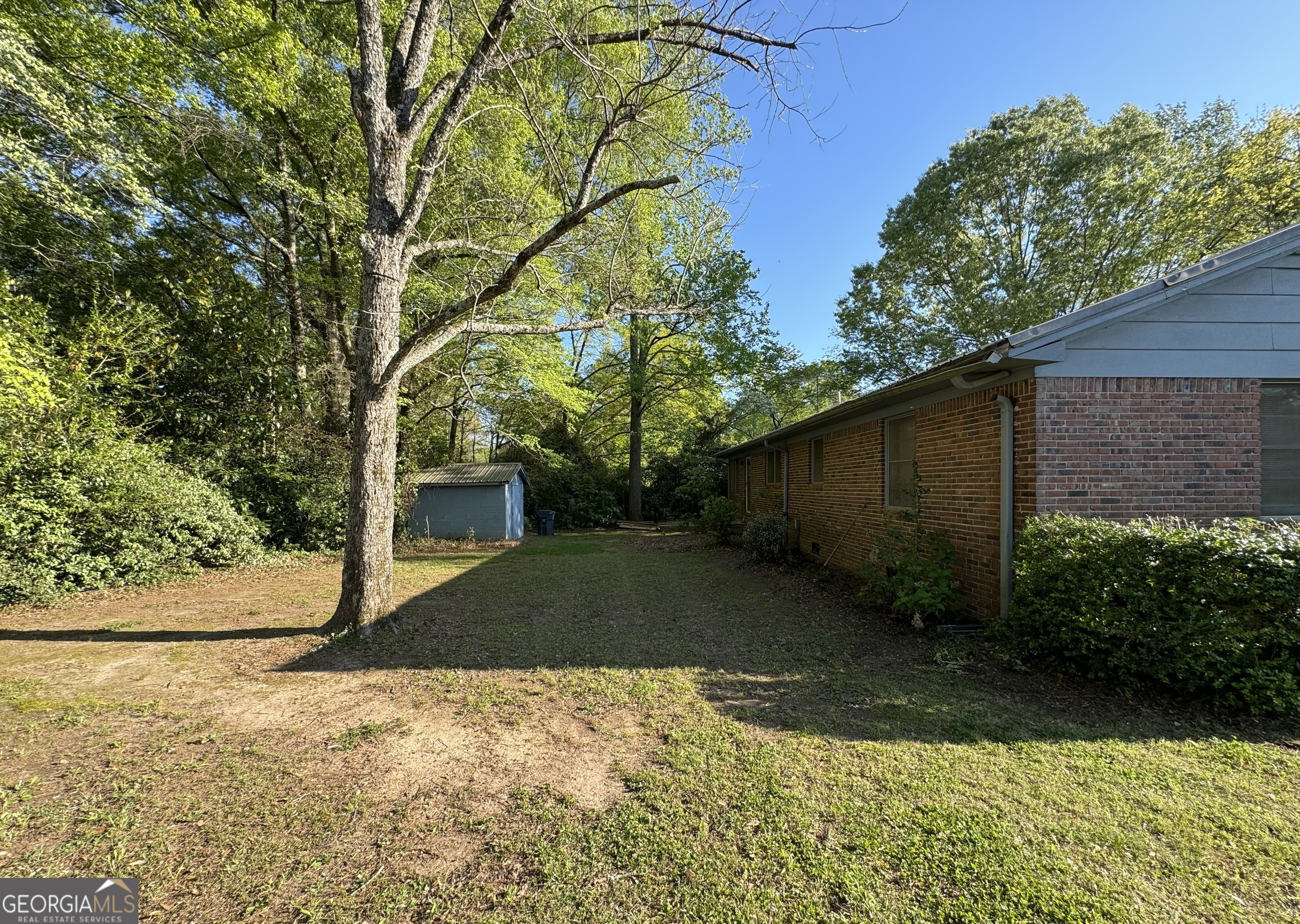 133 McCaskill Drive Jackson, GA 30233 - Photo 23 of 26 a view of backyard of house with green space