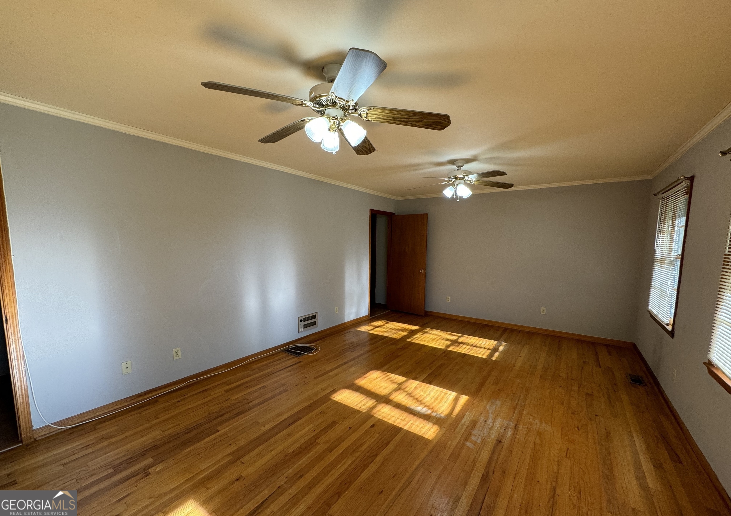 133 McCaskill Drive Jackson, GA 30233 - Photo 3 of 26 a view of empty room with wooden floor