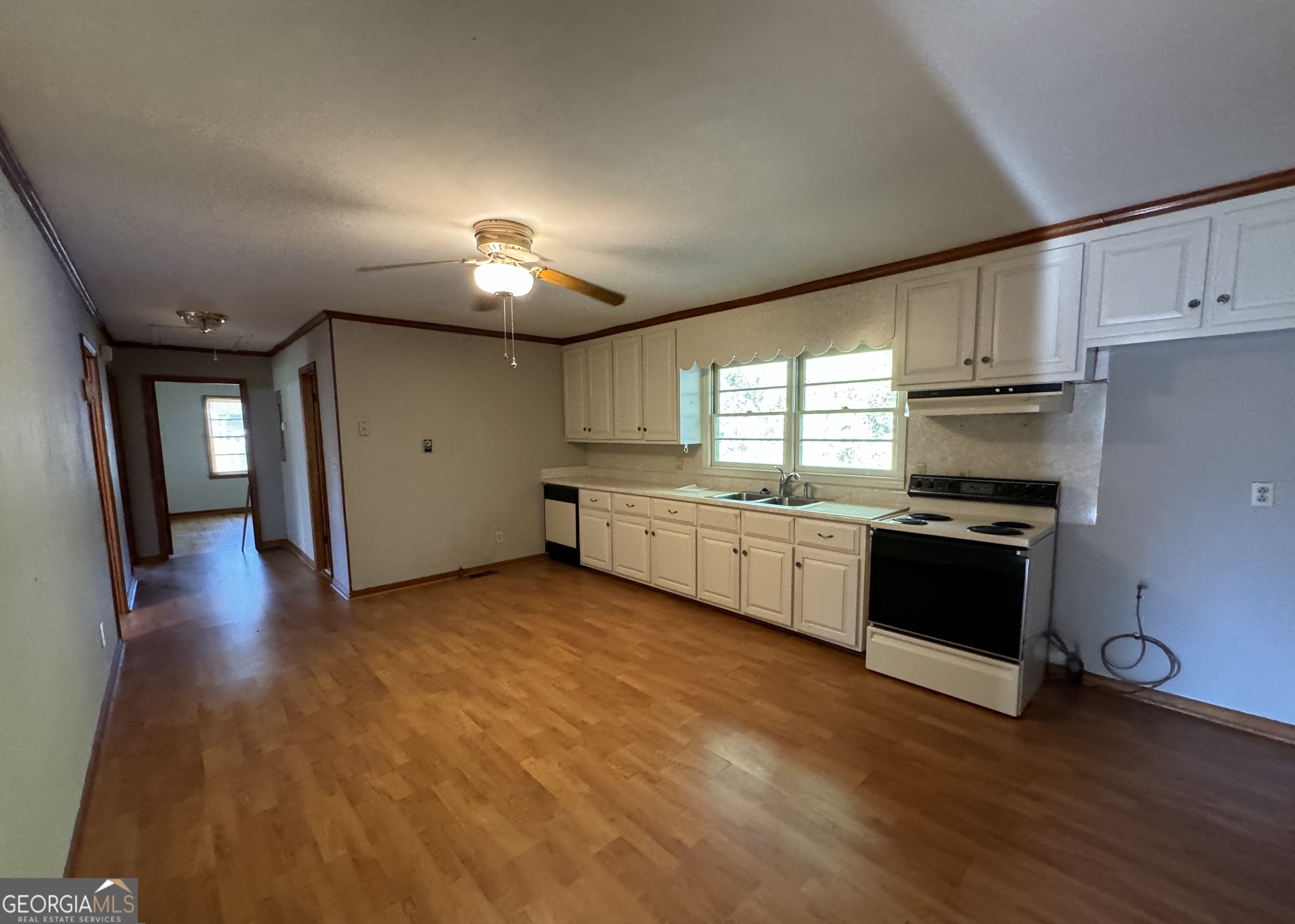 133 McCaskill Drive Jackson, GA 30233 - Photo 6 of 26 a kitchen with stainless steel appliances granite countertop a stove a sink and a refrigerator