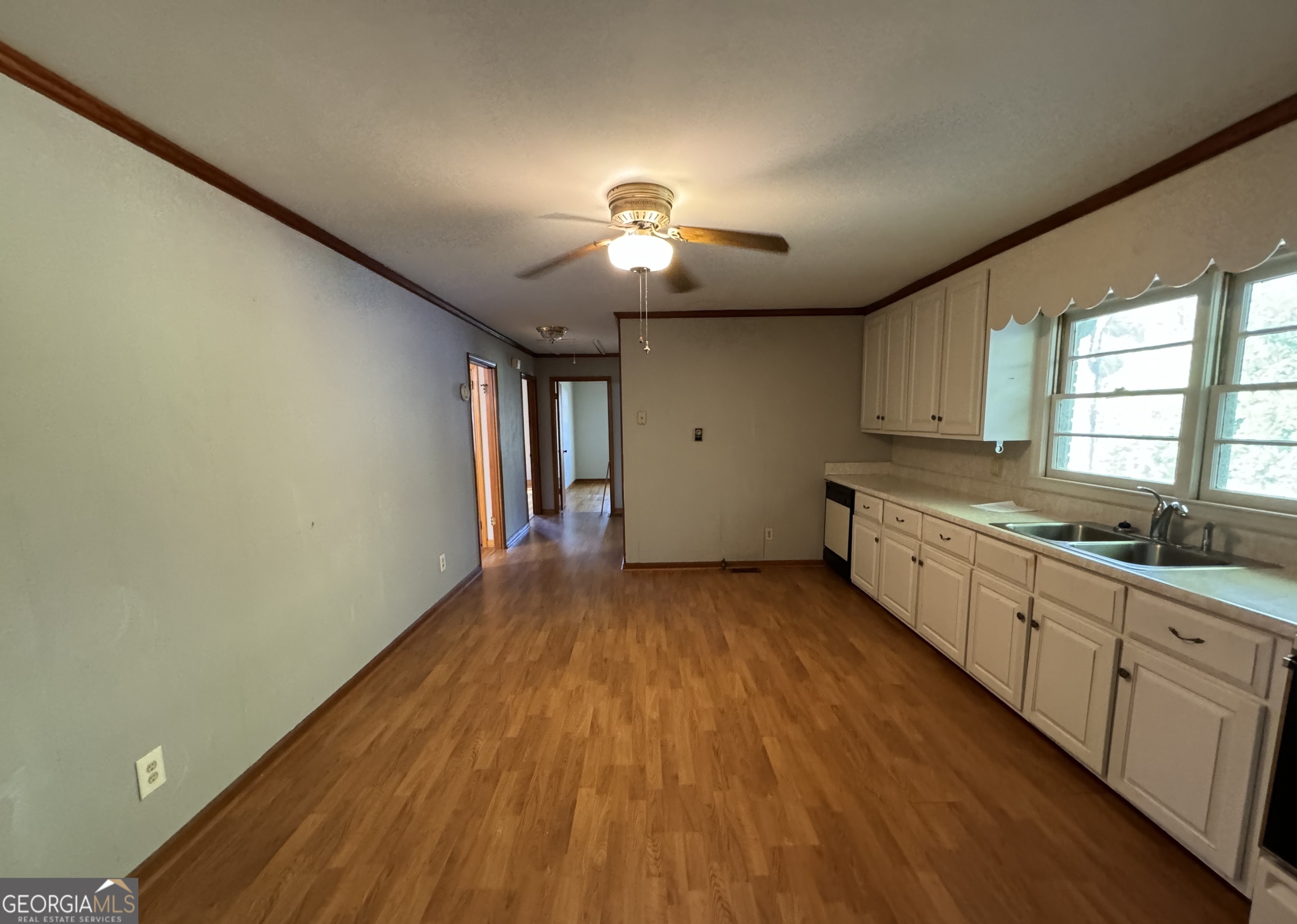 133 McCaskill Drive Jackson, GA 30233 - Photo 7 of 26 a large kitchen with lot of wooden floor and stainless steel appliances