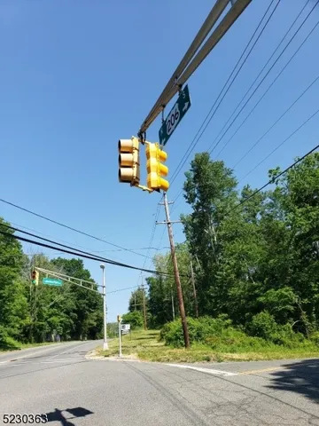 a view of a street with a building in the background