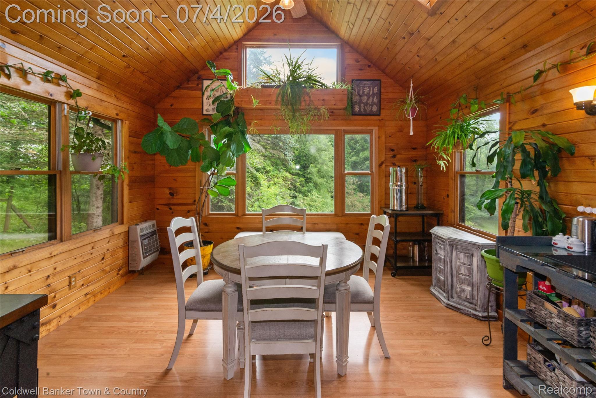 7335 Richardson Road Howell, MI 48843 - Photo 19 of 54 Vaulted wood-paneled ceiling with a central fan and light fixture