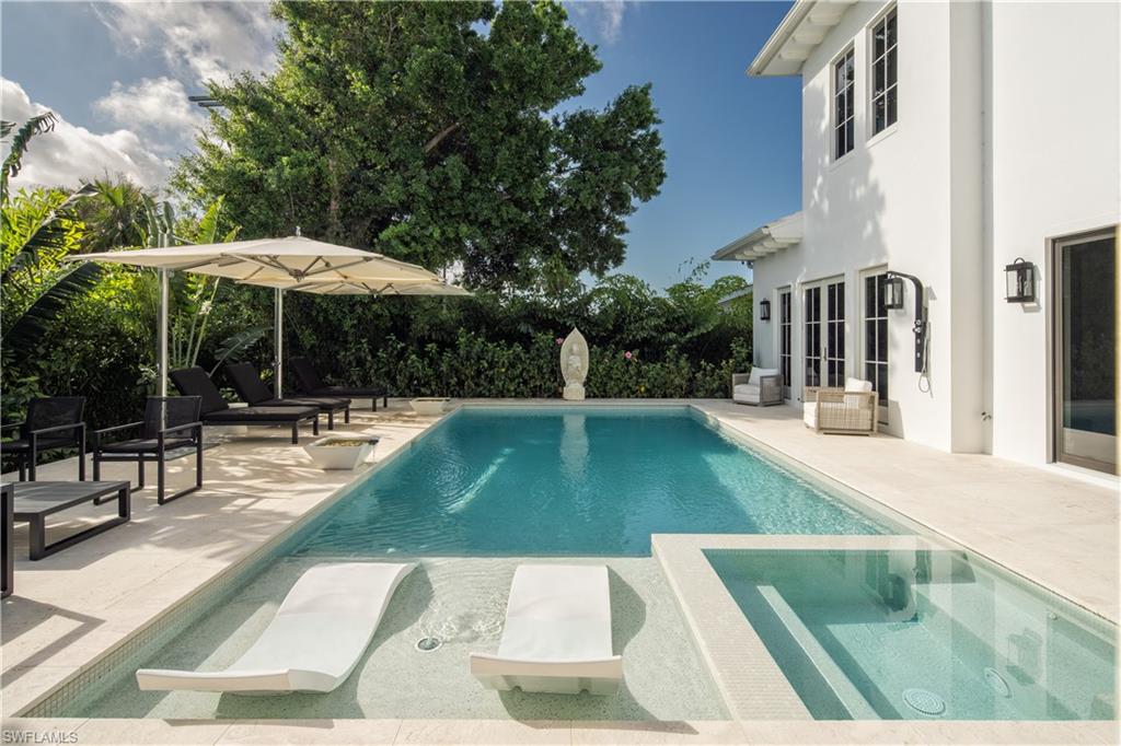 3770 Crayton Road Naples, FL 34103 - Photo 11 of 26 a view of swimming pool with chairs