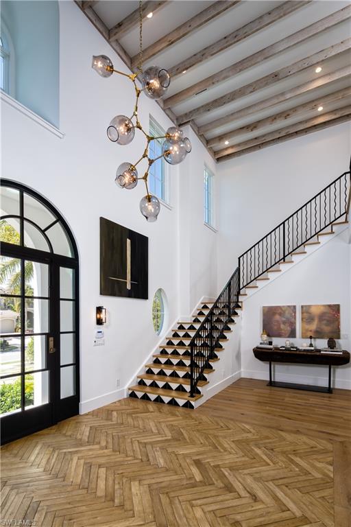3770 Crayton Road Naples, FL 34103 - Photo 13 of 26 a view of entryway and hall with wooden floor