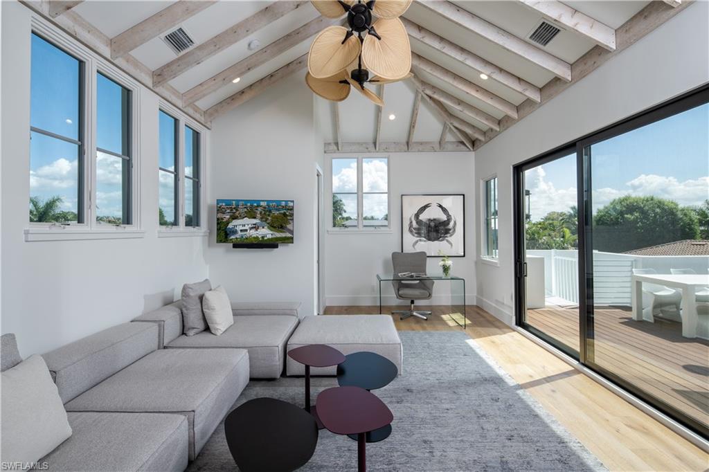 3770 Crayton Road Naples, FL 34103 - Photo 15 of 26 a living room with furniture