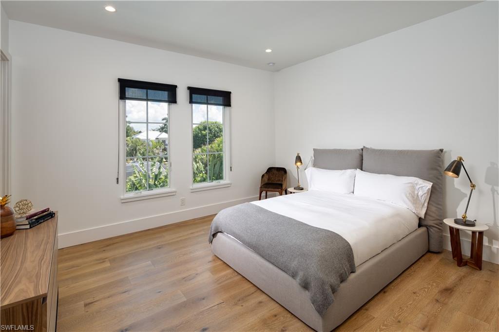 3770 Crayton Road Naples, FL 34103 - Photo 19 of 26 a bedroom with a bed and a window